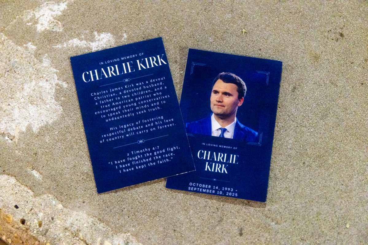The Charlie Kirk photo card sits Friday, Sept 12, 2025, at his vigil in the LSU Student Union Theater in Baton Rouge, La.