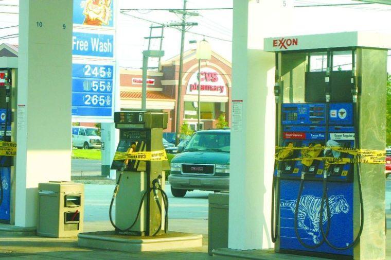 Caution tape was wrapped around the pumps at this Exxon off Highland.