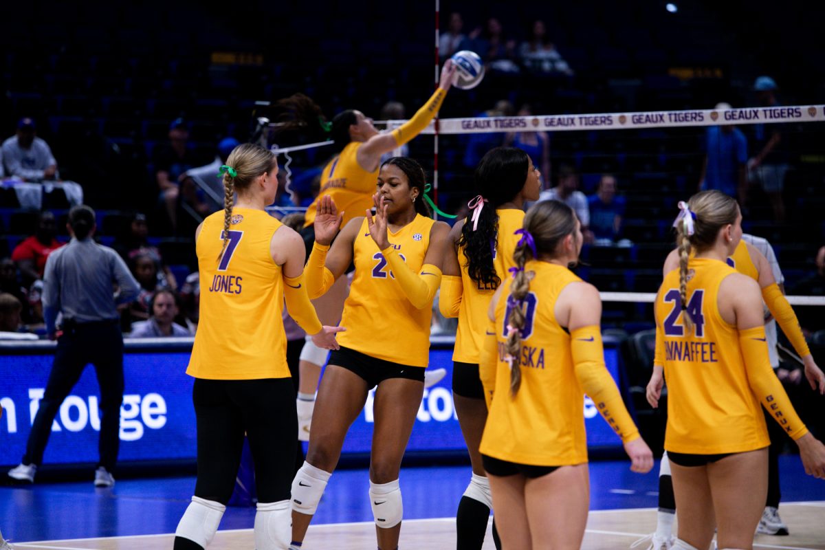 LSU volleyball freshman middle blocker Sanaa Donaie (23) and sophomore middle blocker Jessica Jones (7) high-five before LSU’s 0-3 loss against Kentucky on Sunday, Oct.12, 2025, at the Pete Maravich Assembly Center in Baton Rouge, La.