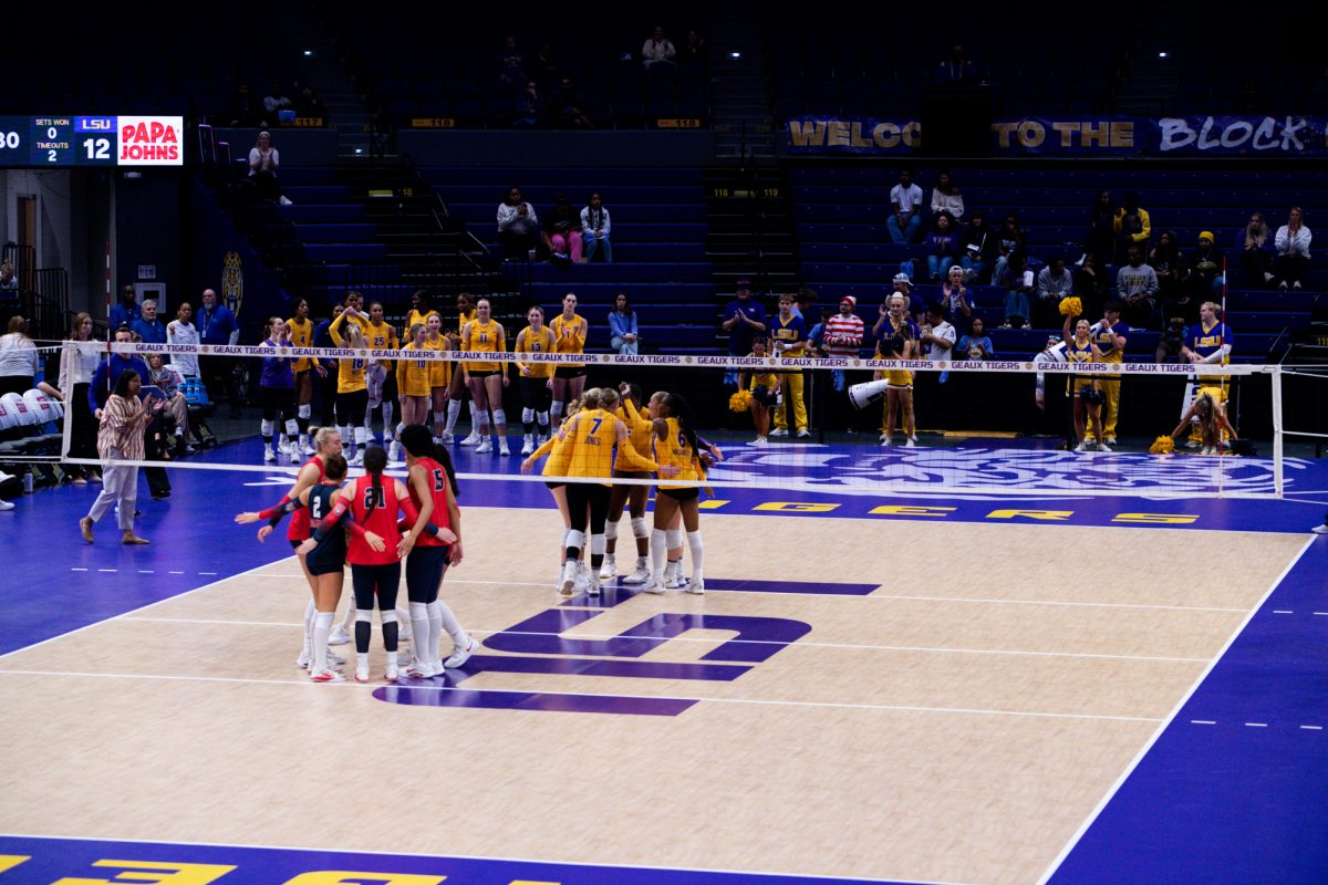 LSU volleyball and Ole Miss huddle during LSU’s 3-2 win against Ole Miss on Sunday, Nov. 2, 2025, at the Pete Maravich Assembly Center in Baton Rouge, La.