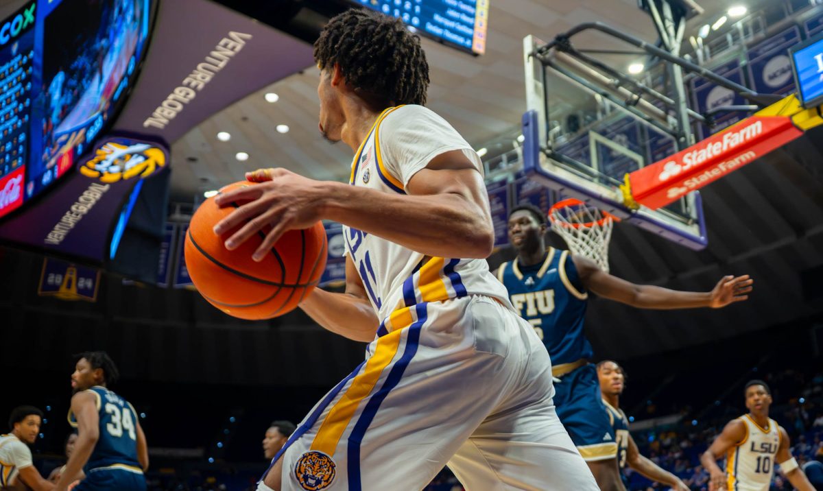 LSU men's basketball junior guard Dedan Thomas Jr. (11) looks for an open man during their 98-81 win over Florida International University Thursday, Nov. 13, 2025, at the Pete Maravich Assembly Center in Baton Rouge, La.
