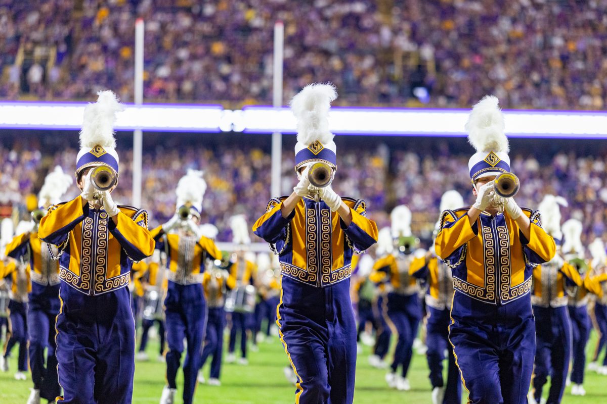 Three members of the trumpet section march with The Golden Band from Tigerland during their pre-game performance before LSU’s 13-10 win against Western Kentucky on Saturday, Nov. 22, 2025, at Tiger Stadium in Baton Rouge, La.