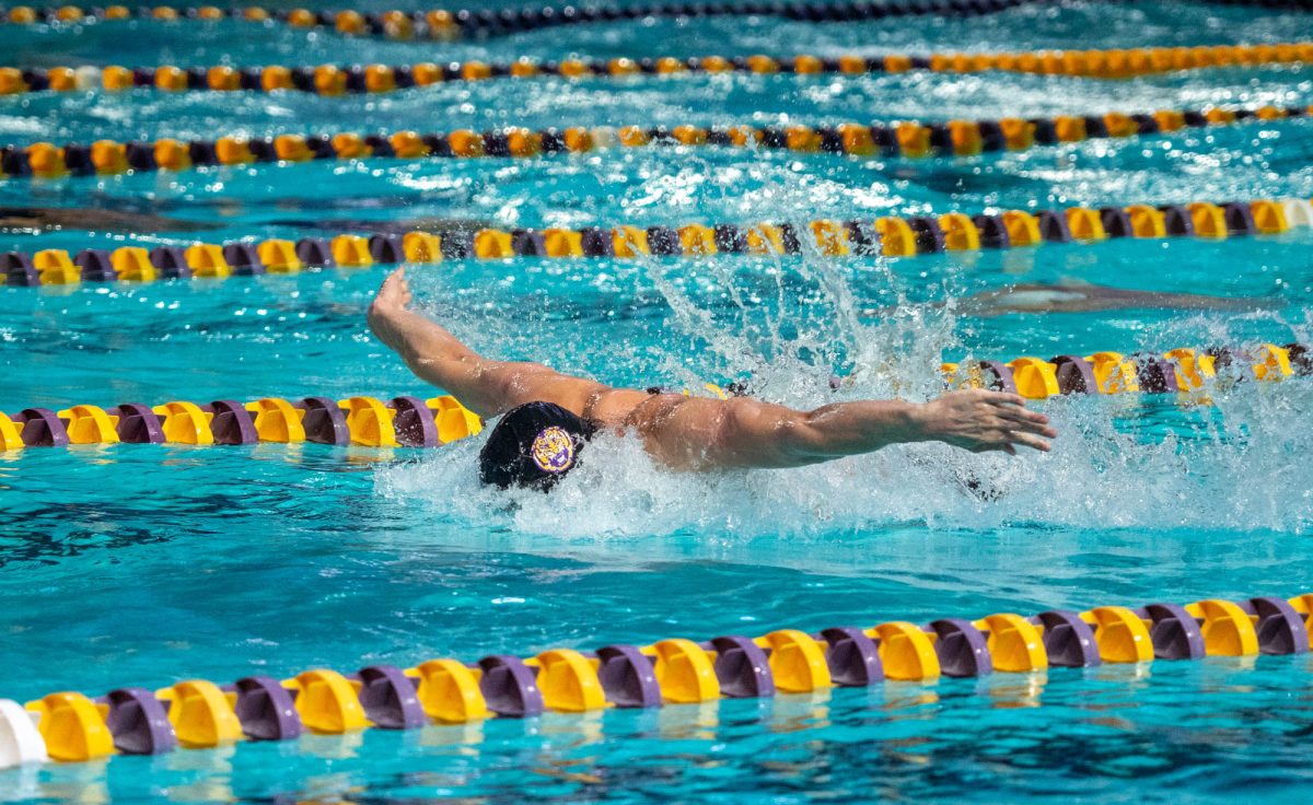 A LSU men's swimmer races down the lane during LSU swimming and diving's full sweep of both the University of Alabama and Florida State University, Friday, Nov. 7, 2025, at the LSU Natatorium in Baton Rouge, La.