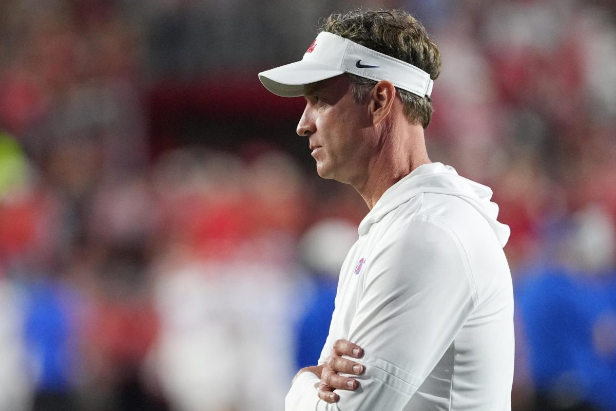 Mississippi head coach Lane Kiffin, watches his team warm up prior to the start of an NCAA college football game against Florida, Saturday, Nov. 15, 2025, in Oxford, Miss.