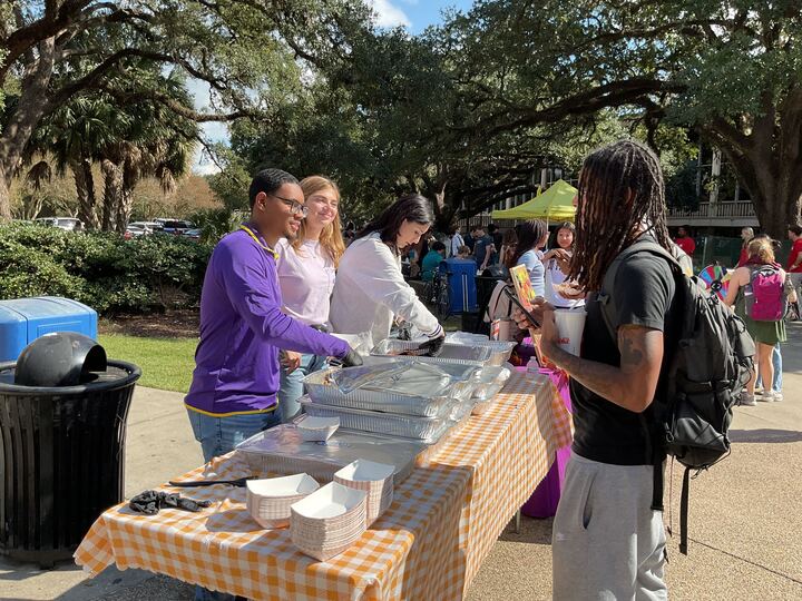 Student Philanthropy Council members give out free jambalaya at their event supporting a food drive in Free Speech Alley on Nov. 13, 2025 in Baton Rouge, La.