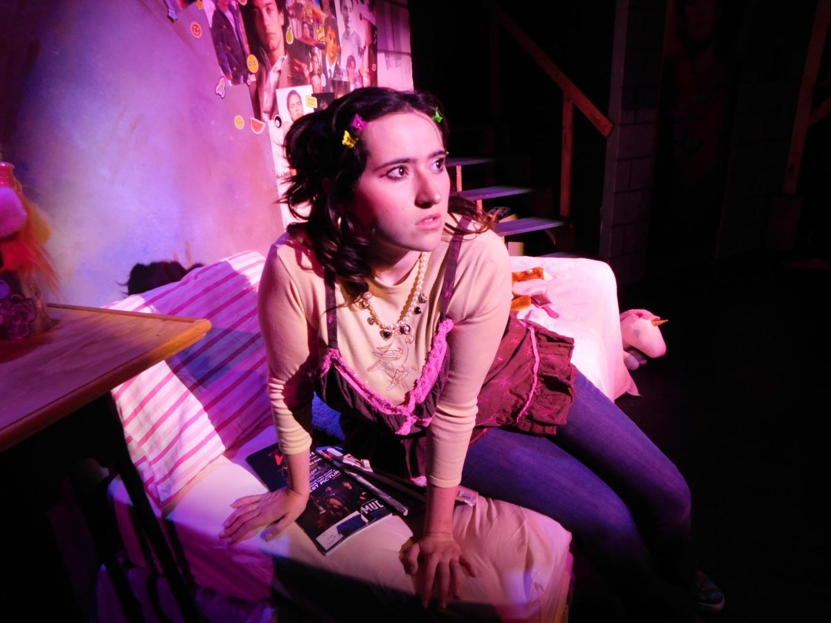 Shelby Hinkley, played by Sophie Rollins, looks away during a production of "I'm Gonna Marry You Tobey Maguire." (Courtesy of Ricardo Mendoza)