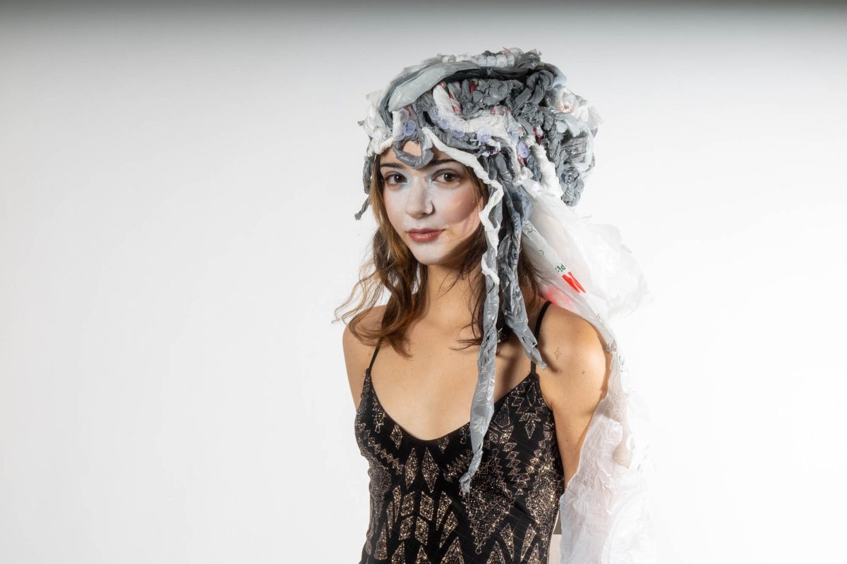 A school of art student wears their handmade plastic bag headpiece Tuesday, Dec. 2, 2025, at the Barnes Ogden Art and Design Complex in Baton Rouge, La.