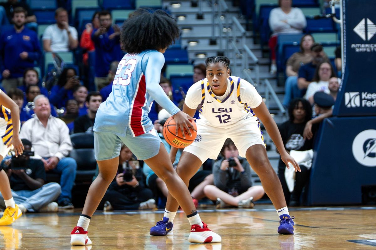 LSU women's basketball junior guard Mikaylah Williams (12) defends LA Tech player during the Tigers' 87-61 victory over LA Tech Saturday, Dec. 13, 2025, at the Smoothie King Center in New Orleans, La.