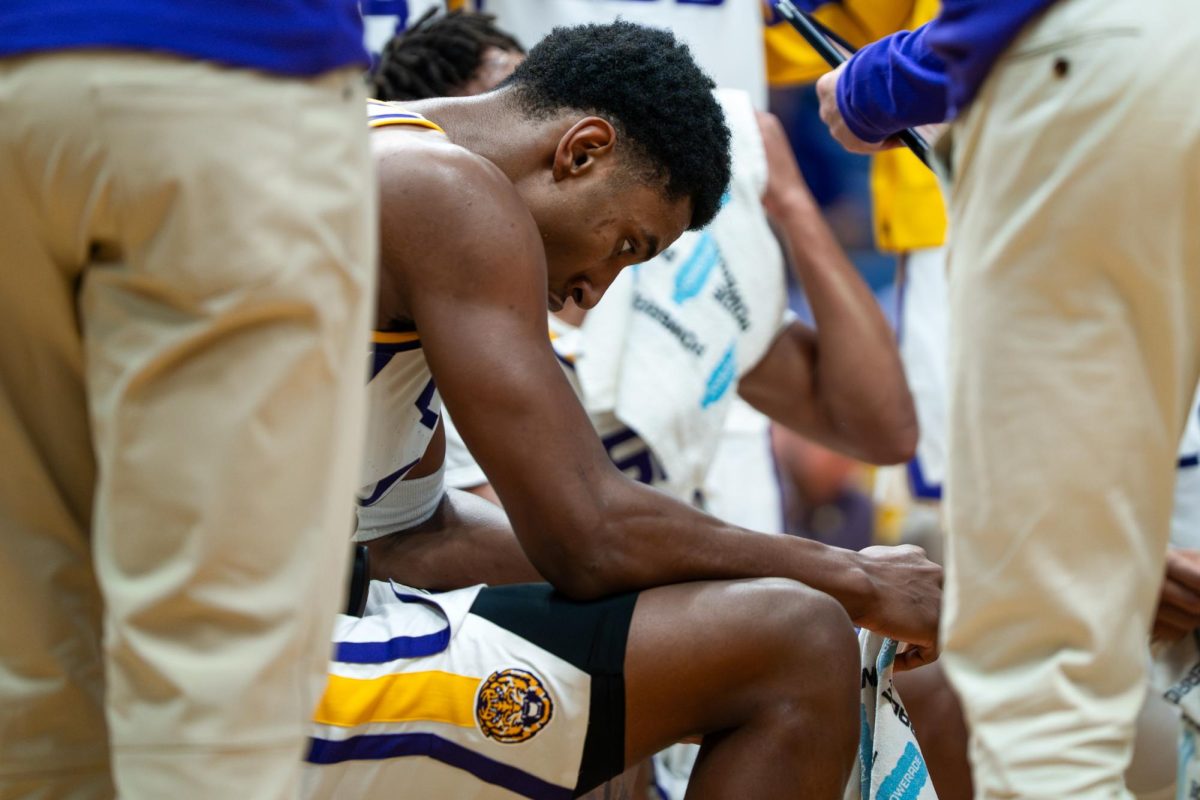 LSU men's basketball senior forward Marquel Sutton (10) sits in huddle during the Tigers' 89-77 victory over SMU Saturday, Dec. 13, 2025, at the Smoothie King Center in New Orleans, La.