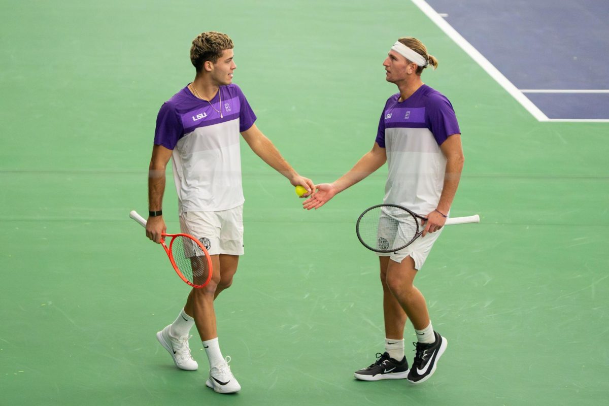 LSU men's tennis freshman Erik Arutiunian celebrates with senior Matias Ponce De Leon during the Tigers' 7-0 victory over South Alabama Sunday Jan. 18, 2026, at the LSU Tennis Complex in Baton Rouge, La.