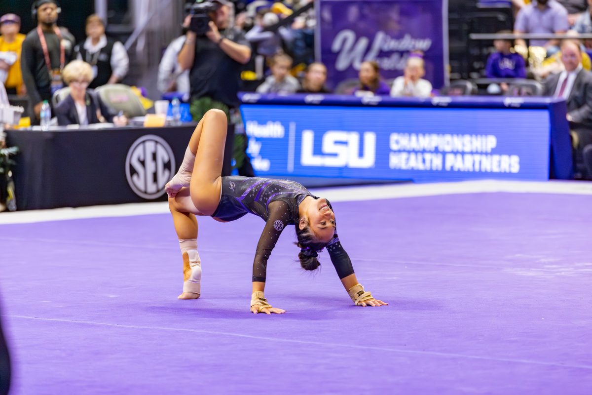 LSU gymnastics sophomore all-around Kailin Chio strikes a pose at the end of her floor exercise performance during LSU’s meet against the University of Kentucky on Friday, Jan. 23, 2026, at the Pete Maravich Assembly Center in Baton Rouge, La.