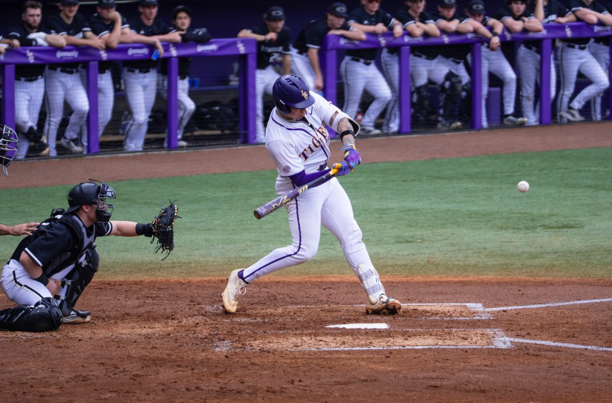 LSU baseball freshman catcher Omar Serna Jr. (25) takes a swing during the Tigers' 5-3 win over Miluaukee Saturday, Feb. 14, 2026, at Alex Box Stadium in Baton Rouge, La.