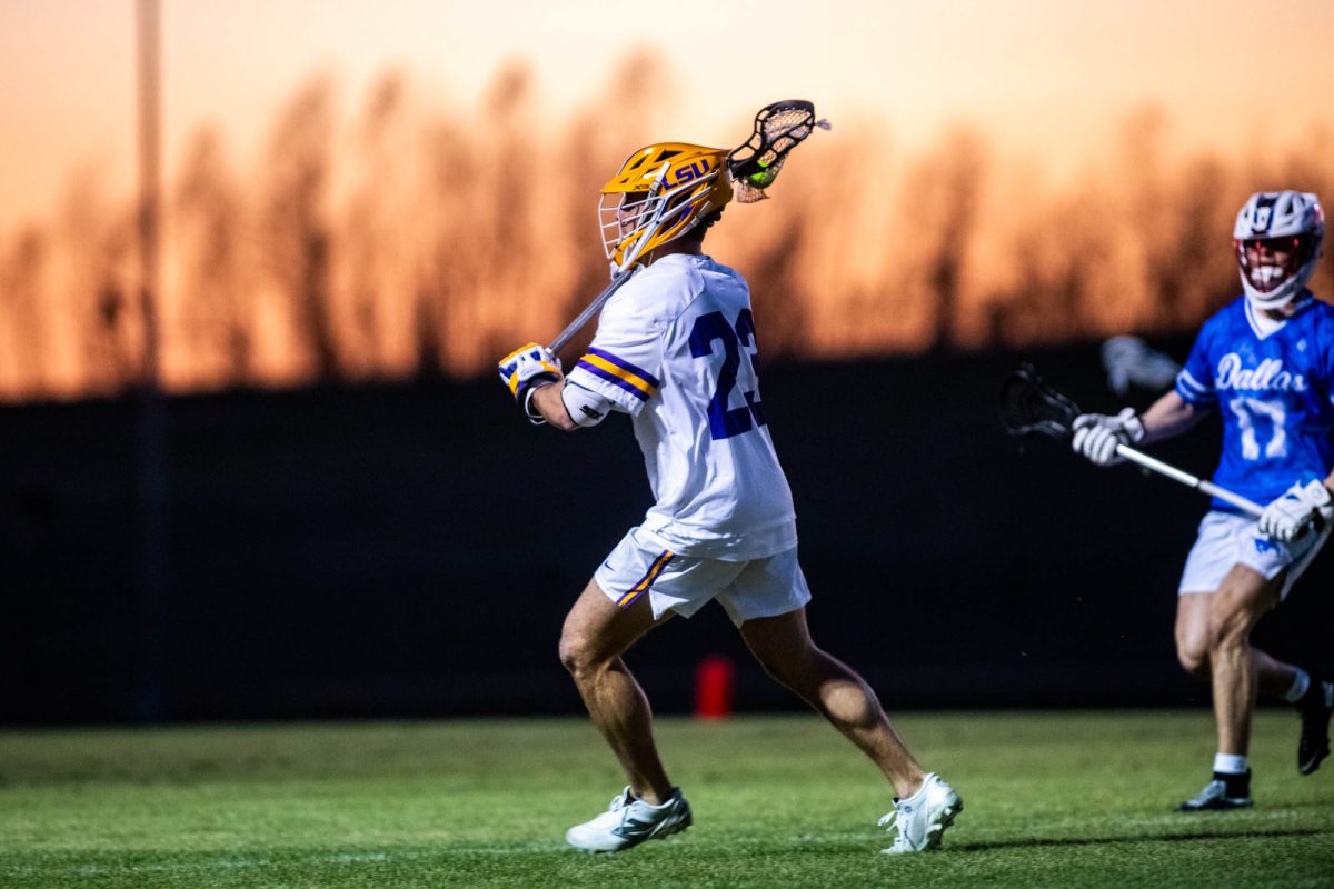 LSU men's lacrosse senior SSDM William Moore (23) runs Friday, Feb. 6, 2026, during their 6-7 loss against SMU at the UREC Field Complex in Baton Rouge, La.
