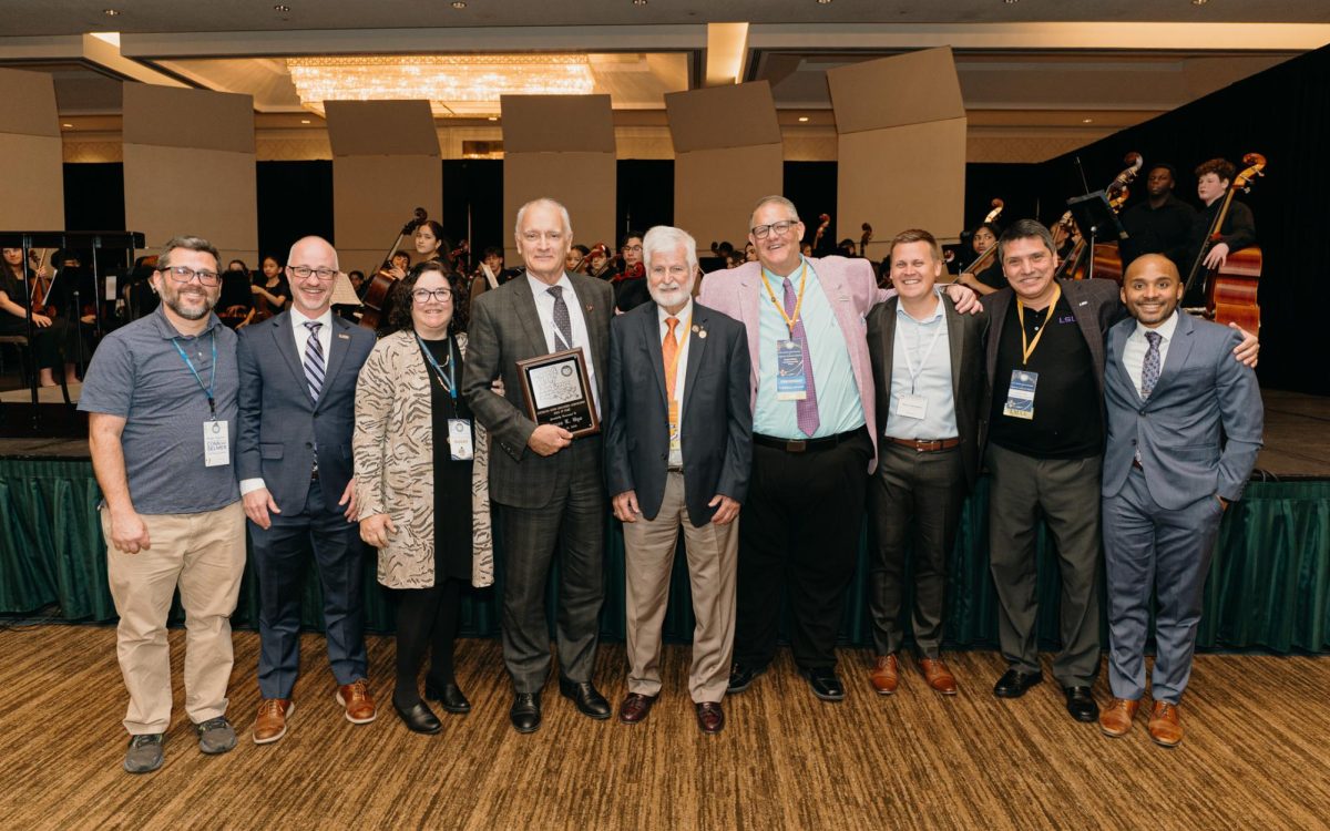 James Byo recieves LMEA Hall of Fame plaque on January 19, 2026 in Baton Rouge, La.
Left to Right
Doug Stone (School of Music faculty)
Eric Lau (CMDA Dean)
Jane Cassidy (LSU Senior Vice Provost)
James Byo
Tom Burroughs (LMEA Hall of Fame Chair)
Lee Hicks (LMEA President)
Simon Holoweiko (SoM faculty)
Damon Talley (SoM faculty)
Weston Lewis (SoM faculty)