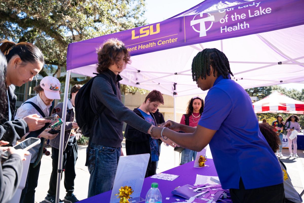 A student receives a wristband Friday, Feb. 6, 2026, on LSU campus in Baton Rouge, La.