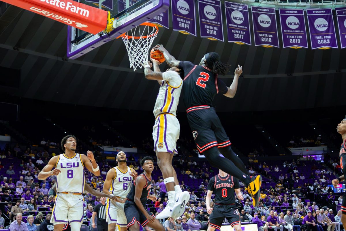 LSU men's basketball senior guard Rashad King (4) gets fouled during the Tigers' 83-71 loss against Georgia Saturday, Feb. 7, 2026, at the Pete Maravich Assembly Center in Baton Rouge, La.
