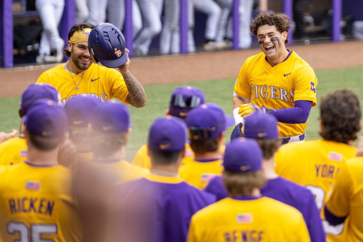 LSU baseball teammates celebrate during the Tigers' 21-7 victory vs Milwaukee Sunday, Feb. 15, 2026, at Alex Box Stadium in Baton Rouge, La.