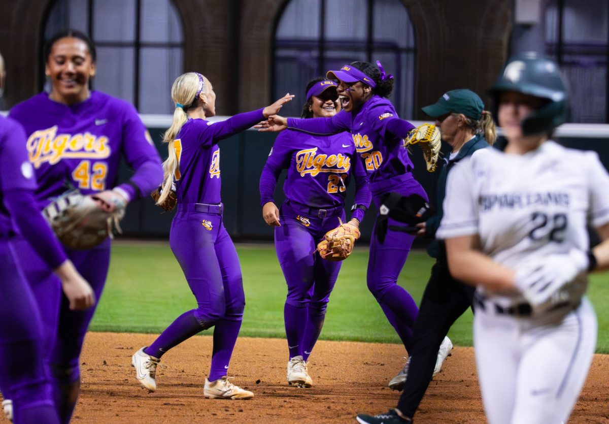 LSU softball players celebrate during the Tigers' 5-4 win over Michigan State Saturday, Feb. 21, 2026, at Tiger Park in Baton Rouge, La.