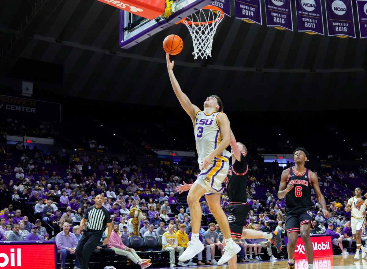 LSU men's basketball senior guard Max Mackinnon (3) goes up to the rim during the Tigers' 83-71 loss against Georgia Saturday, Feb. 7, 2026, at the Pete Maravich Assembly Center in Baton Rouge, La.