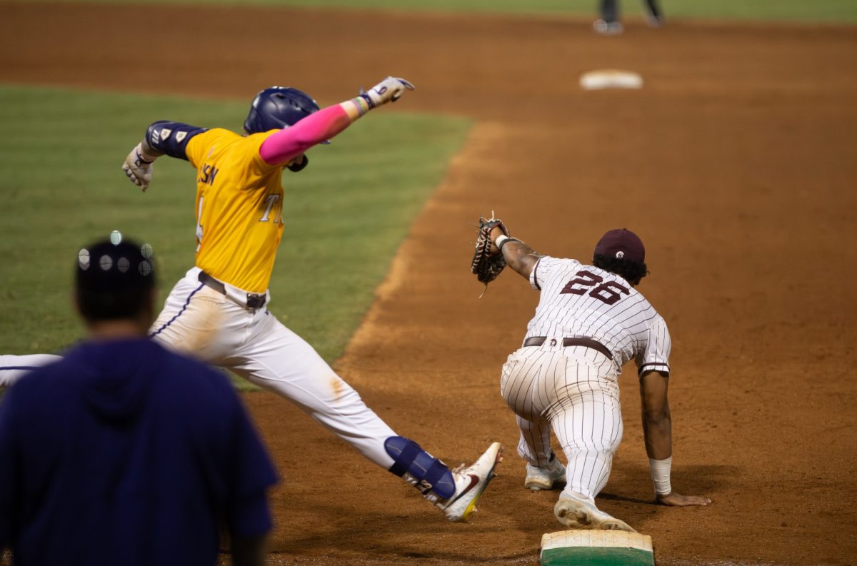 LSU baseball junior infielder Daniel Dickinson (14) is tagged out at first base during LSU's 4-10 loss to Little Rock on Sunday, June 1, 2025, at Alex Box Stadium on Gourrier Avenue in Baton Rouge, La.