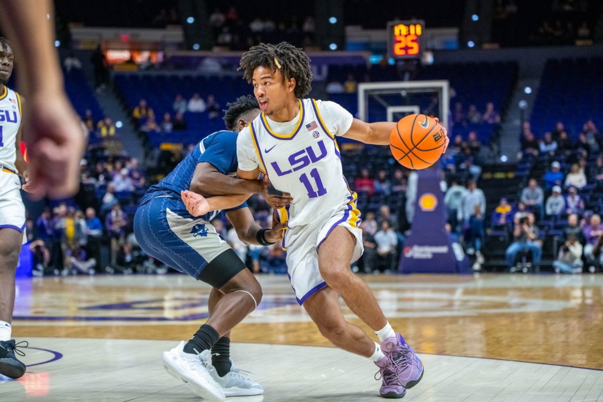 Dedan Thomas Jr. (11) runs around a defender Monday, Nov. 10, 2025, during their 93-58 win against New Orleans at the Pete Maravich Assembly Center in Baton Rouge, La. 