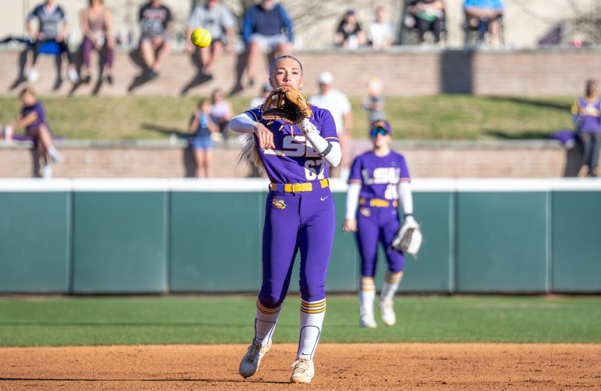 LSU softball junior infielder Kylee Edwards (67) throws the ball during the Tigers' 6-2 win over Nevada Friday, Feb. 6, 2025 at Tiger Park in Baton Rouge, La.