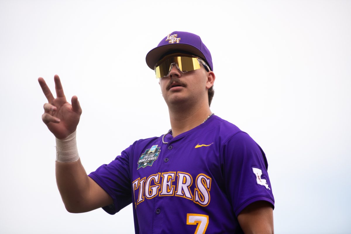 LSU baseball sophomore outfielder Jake Brown (7) waves to fans before LSU’s 4-1 win over Arkansas during the  Men’s College World Series Saturday, June 14, 2025, at Charles Schwab Field on Mike Fahey Street in Omaha, Ne.