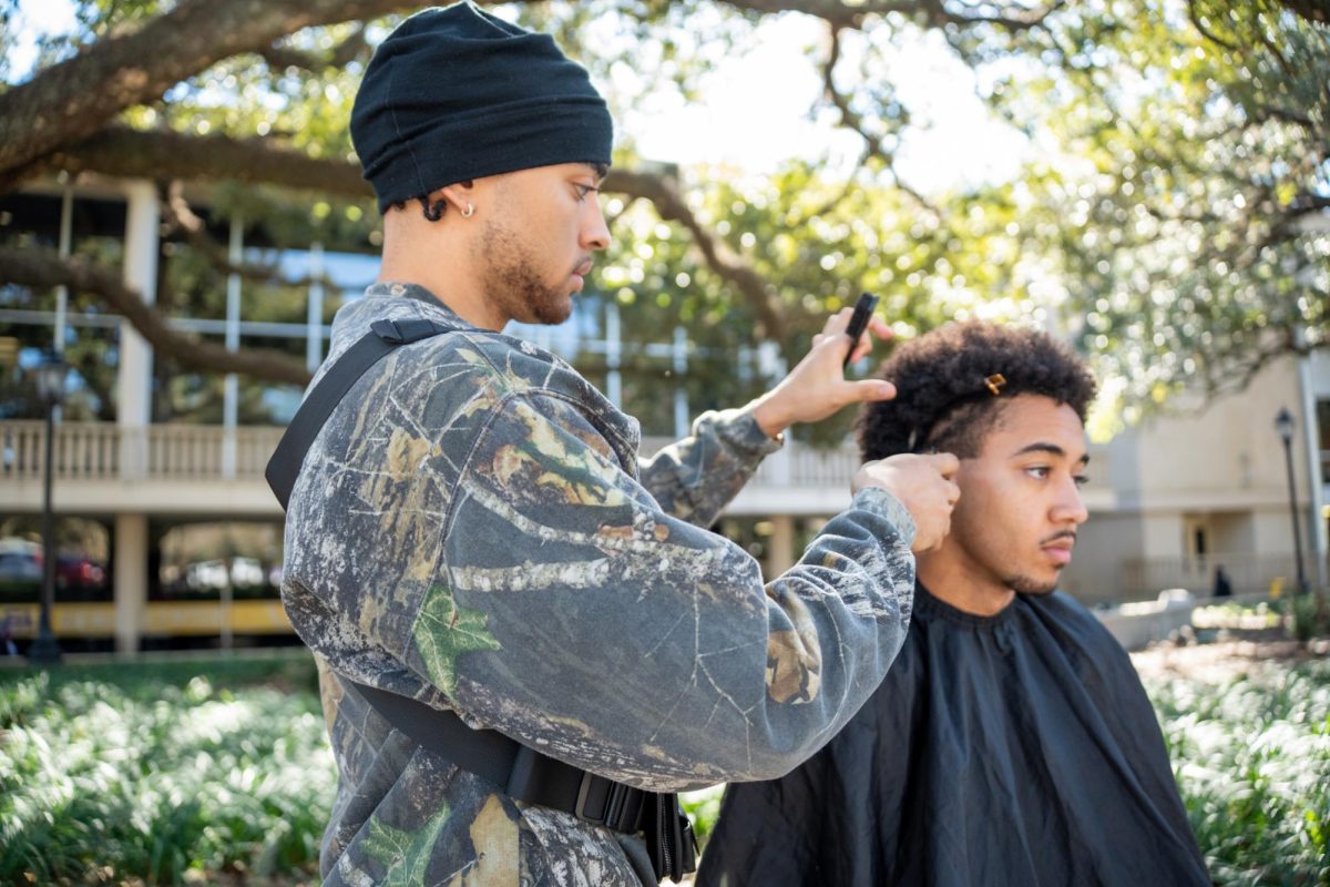 LSU accounting sophomore Larry Smith cuts hair Monday, Feb. 2, 2026, at Free Speech Alley in Baton Rouge, La.