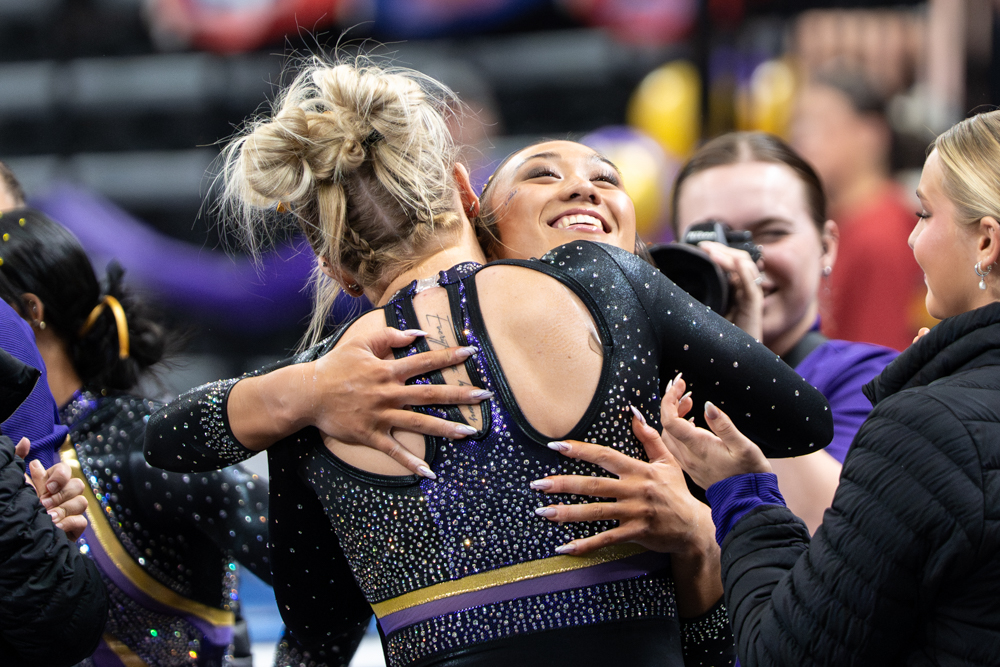 LSU gymnastics all-around sophomore Kailin Chio hugs her teammate during the Podium Challenge against Alabama, North Carolina and Arizona Sunday, March 1, 2026, at the Raising Cane’s River Center in Baton Rouge, La.