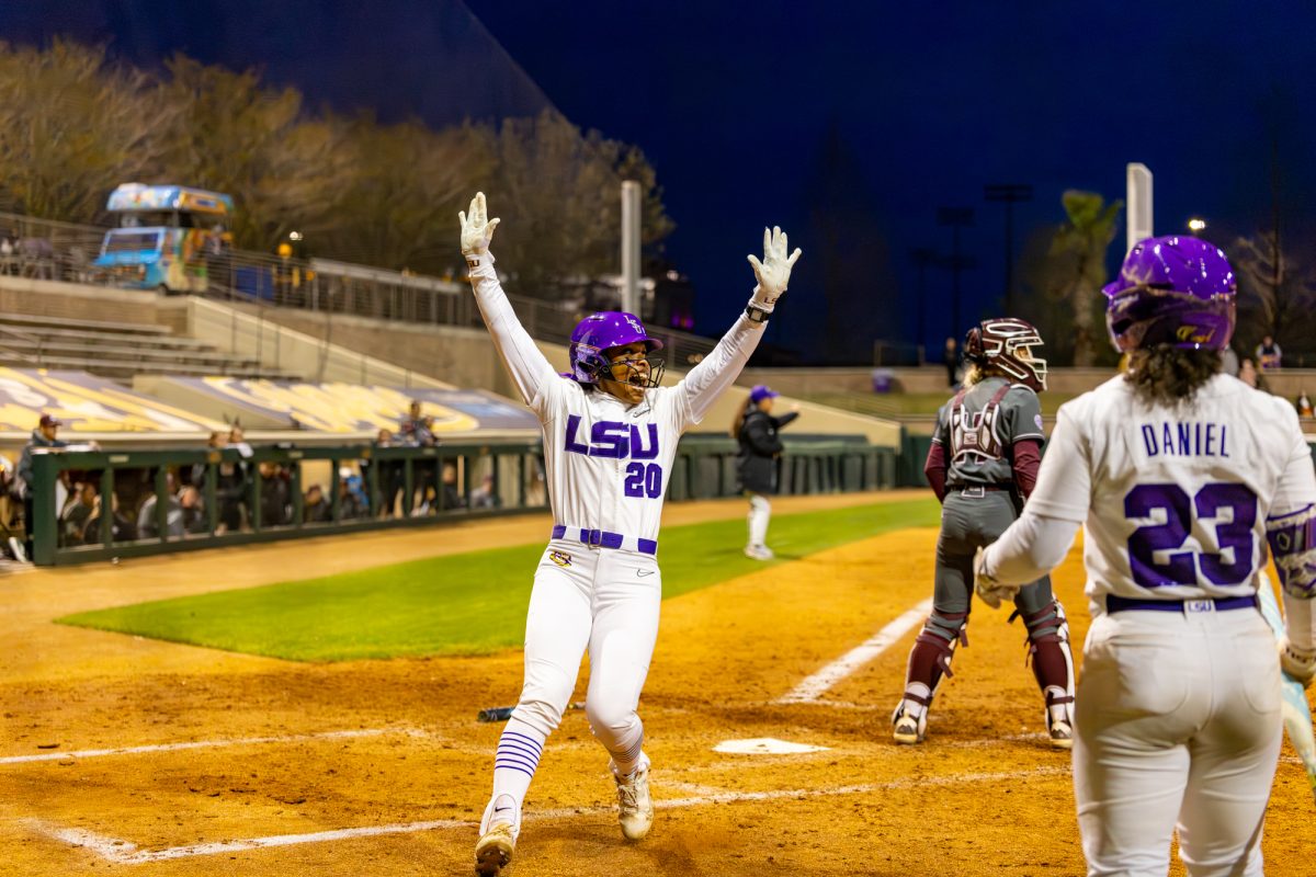 LSU softball sophomore utility player Alix Franklin (20) celebrates as she runs into home plate during LSU’s 7-2 win against Texas A&amp;M on Monday, March 16, 2026, at Tiger Park in Baton Rouge, La.