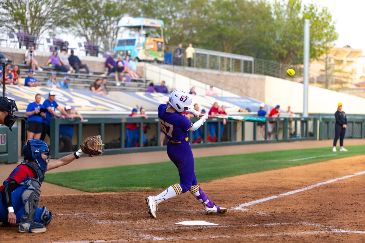 LSU softball junior infielder Kylee Edwards (67) hits a home run during LSU’s 9-0 win against Louisiana Tech on Tuesday, March 24, 2026, at Tiger Park in Baton Rouge, La.