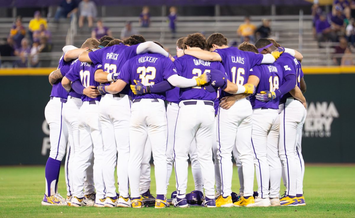 LSU baseball players pray before the Tigers' 5-3 win over Dartmouth Friday, Feb. 28, 2026, at Alex Box Stadium in Baton Rouge, La.