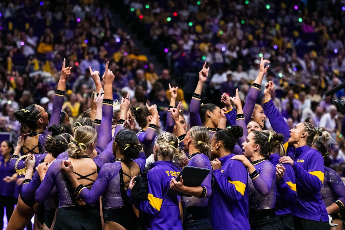 The LSU gymnastics team huddles together during LSU’s 197.975-197.600 win against Alabama on Friday, Feb. 27, 2026, at the Pete Maravich Assembly Center in Baton Rouge, La.