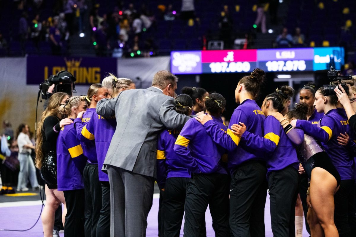 LSU gymnastics head coach Jay Clark huddles with the team after their 197.975-197.600 win against Alabama on Friday, Feb. 27, 2026, at the Pete Maravich Assembly Center in Baton Rouge, La.