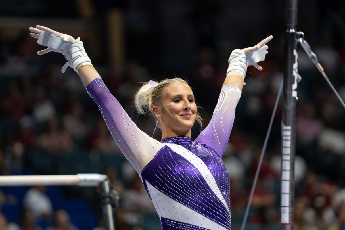 LSU gymnastics vault/uneven bars/floor exercise graduate student Courtney Blackson salutes the judges during the Tigers' SEC Championship loss Saturday, March 21, 2026, at the Bank of Oklahoma Center in Tulsa, Okla.