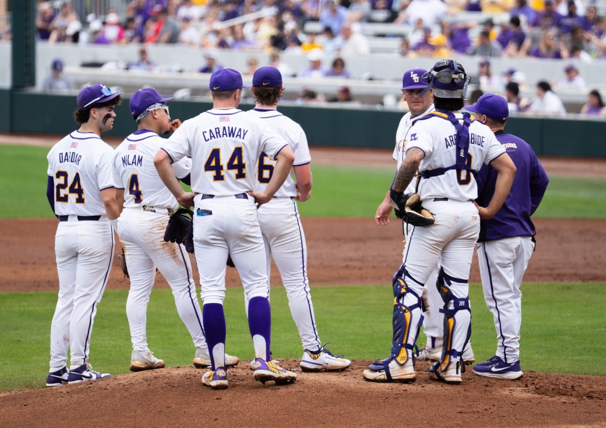 LSU baseball players gather on the mound during the Tigers' 12-1 win over Nicholls on Wednesday, Feb. 18, 2026, at Alex Box Stadium in Baton Rouge, La.
