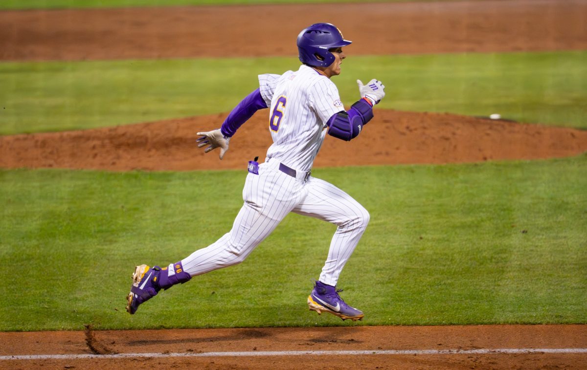 LSU baseball sophomore outfielder Derek Curiel (6) runs to first during the Tigers' 7-6 loss against McNeese Tuesday, Feb. 24, 2026, at Alex Box Stadium in Baton Rouge, La.