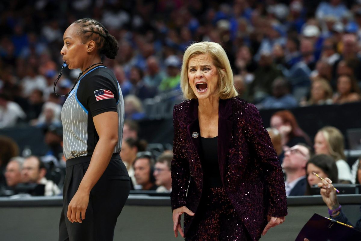 LSU head coach Kim Mulkey yells to her team during the first half in the Sweet 16 of the NCAA college basketball tournament against Duke Friday, March 27, 2026, in Sacramento, Calif. (AP Photo/Sara Nevis)