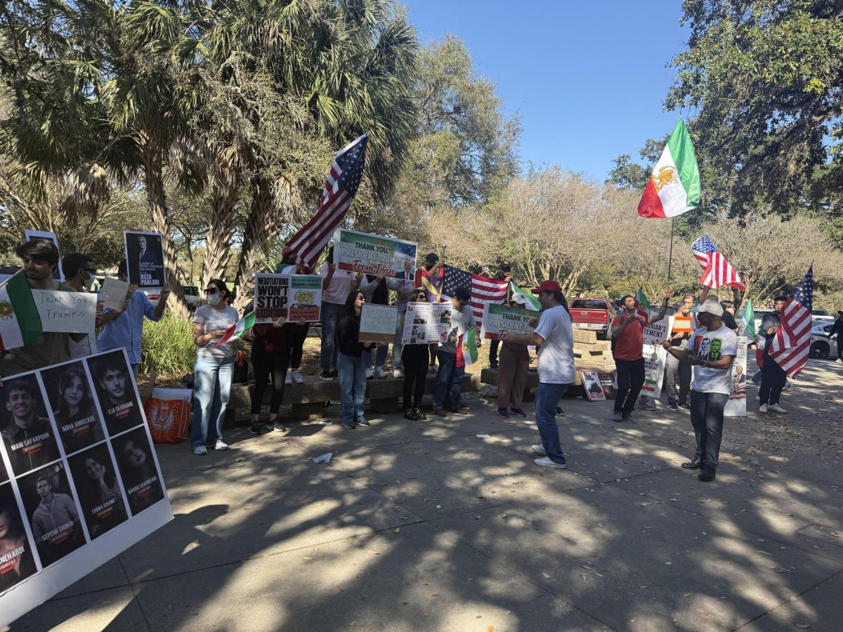 Demonstrators gather to support President Trump's military intervention in Iran in Free Speech Alley on March 2, 2026