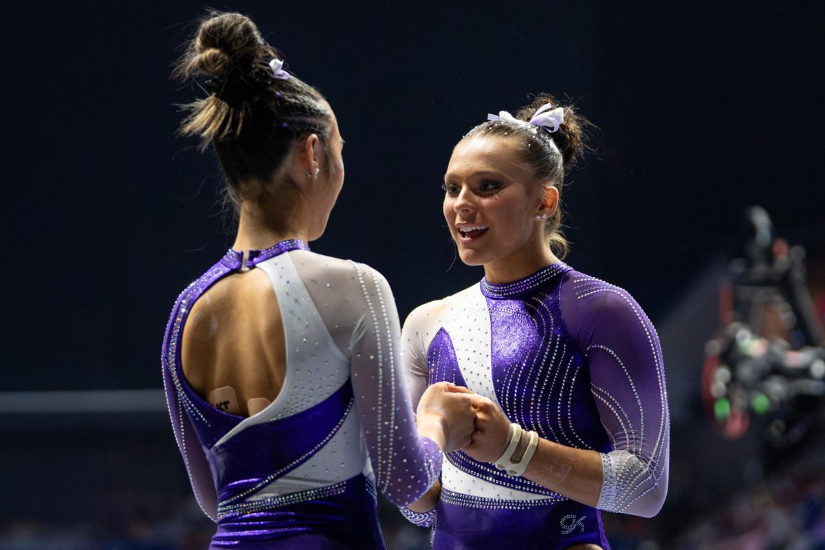 LSU gymnastics all-around sophomore Lexi Ziess talks to all-around sophomore Kailin Chio during the Tigers' SEC Championship loss Saturday, March 21, 2026, at the Bank of Oklahoma Center in Tulsa, Okla.