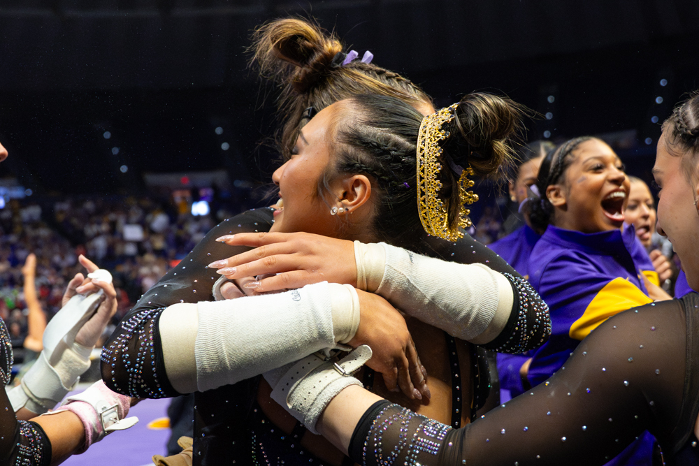 LSU gymnastics all-around sophomore Kailin Chio hugs her teammate during the Tigers' 197.825 win Saturday, April 4, 2026, at the Pete Maravich Assembly Center in Baton Rouge, La.
