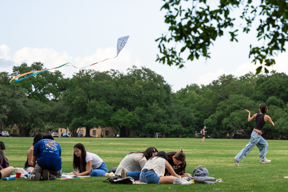A student flies a kite in the air Friday, April 10 2026, on LSU campus in Baton Rouge, La.