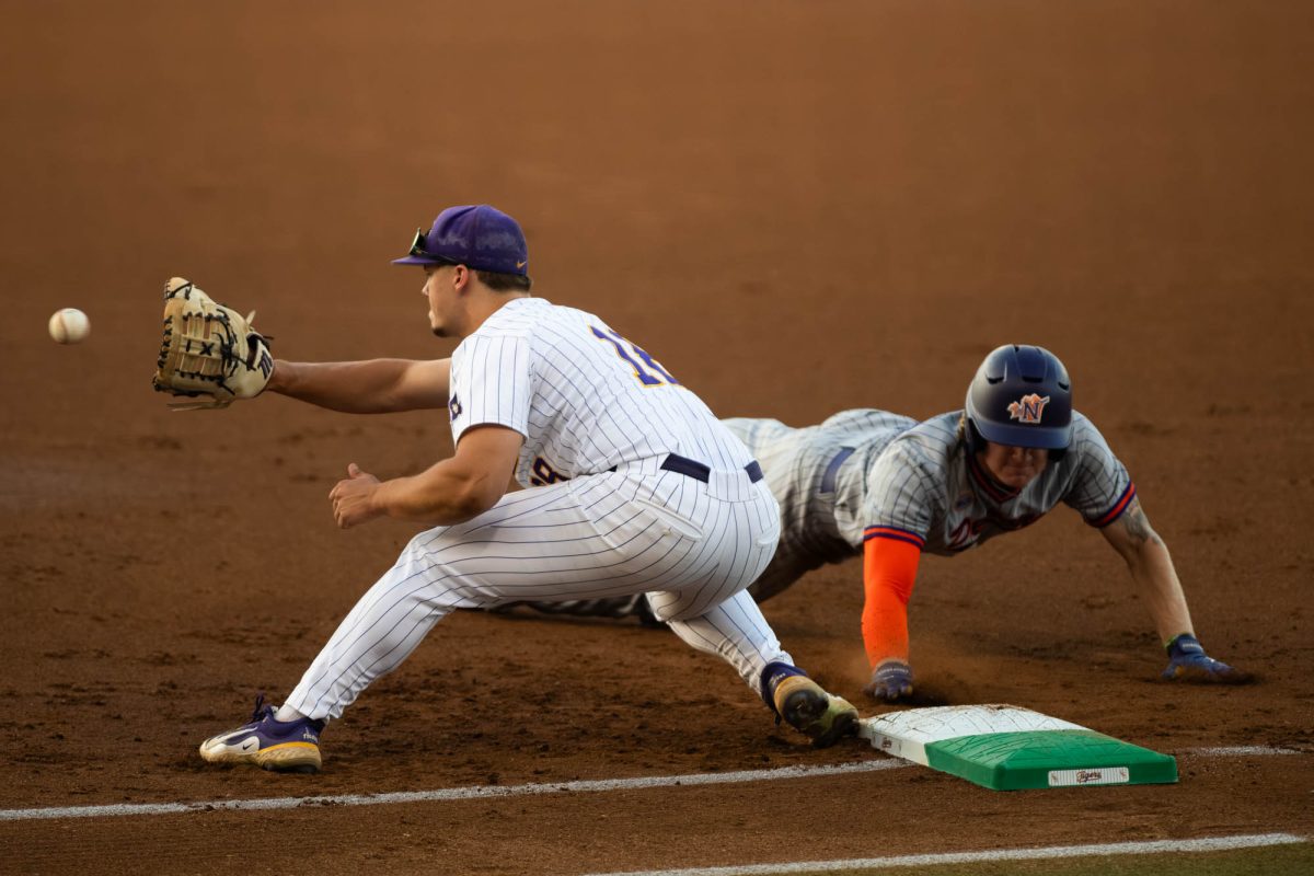 LSU baseball freshman outfield/first base Mason Braun (18) catches the ball Tuesday, April 14, 2026,  during LSU’s 4-2 win against Northwestern State University at Alex Box Stadium in Baton Rouge, La.