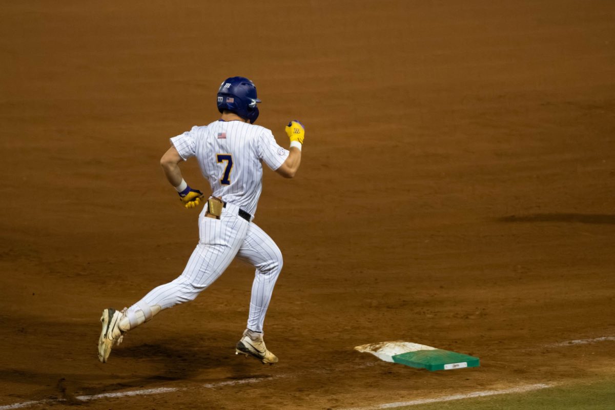 LSU baseball junior outfielder Jake Brown (7) runs Tuesday, April 14, 2026, during LSU’s 4-2 win against Northwestern State University at Alex Box Stadium in Baton Rouge, La.
