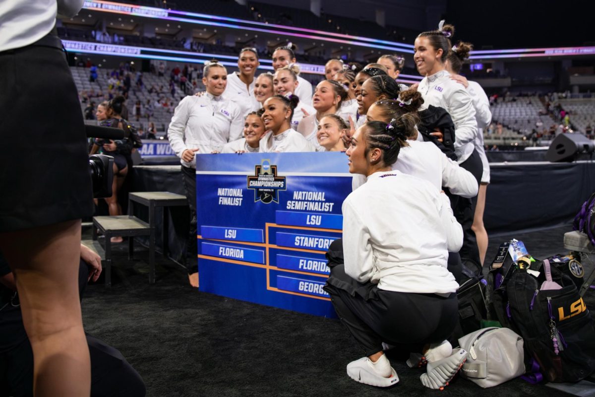 LSU gymnastics teammates pose for a picture during the Tigers' 197.4375 win Thursday, April 16, 2026, at the Dickies Arena in Fort Worth, Texas.