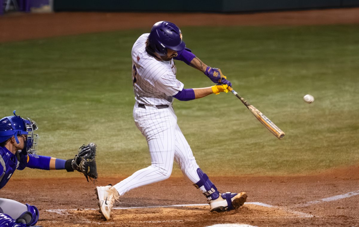 LSU baseball sophomore catcher Cade Arrambide (0) hits the ball during the Tigers' 7-6 loss against McNeese Tuesday, Feb. 24, 2026 at Alex Box Stadium in Baton Rouge, La.