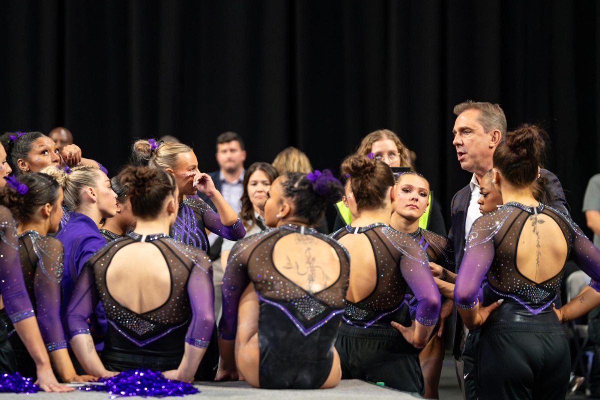 LSU gymnastics head coach Jay Clark talks during the Tigers' 198.0750 loss Saturday, April 18, 2026, at the Dickies Arena in Fort Worth, Texas.