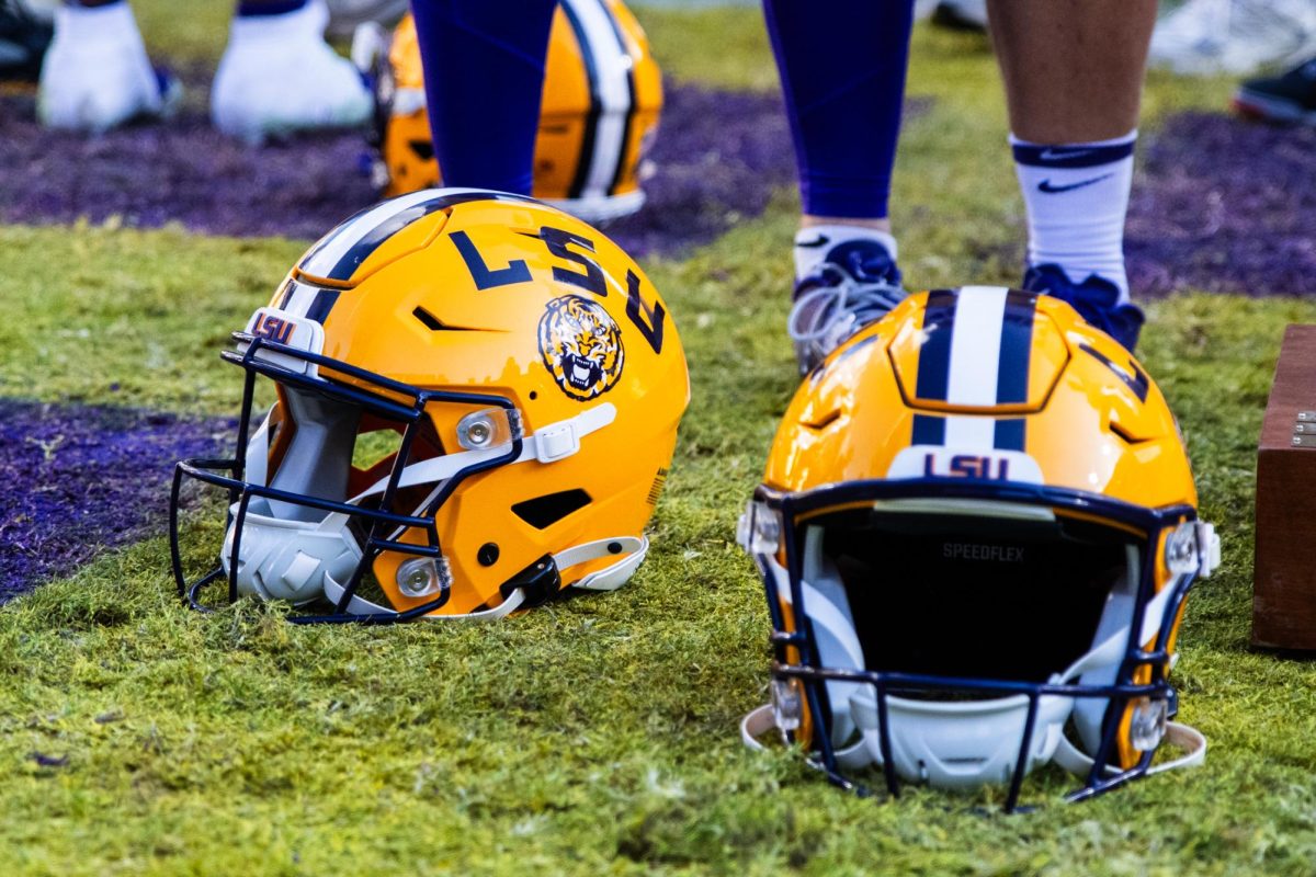 LSU football helmets sit on the field on Saturday, Nov. 15, 2025, after LSU’s 23-22 win against Arkansas at Tiger Stadium in Baton Rouge, La.