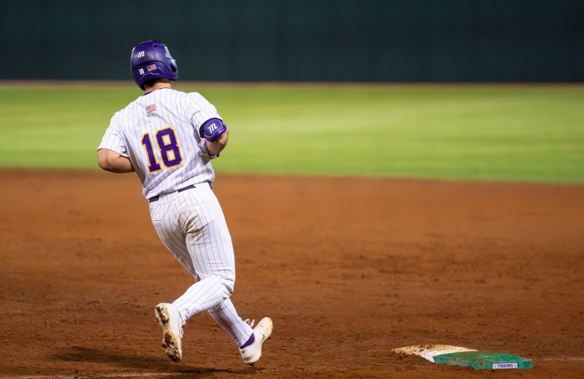LSU baseball freshman outfielder and first basemen Mason Braun (18) stops at first during the Tigers' 7-6 loss against McNeese Tuesday, Feb. 24, 2026 at Alex Box Stadium in Baton Rouge, La.