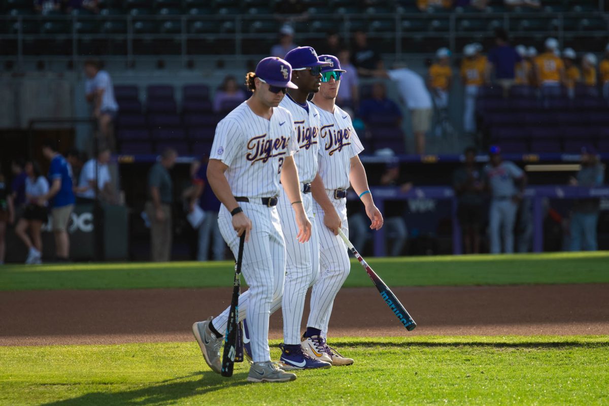 LSU baseball players walk on the field Tuesday, April 14, 2026, prior to LSU 4-2 win against Northwestern State University at Alex Box Stadium in Baton Rouge, La.